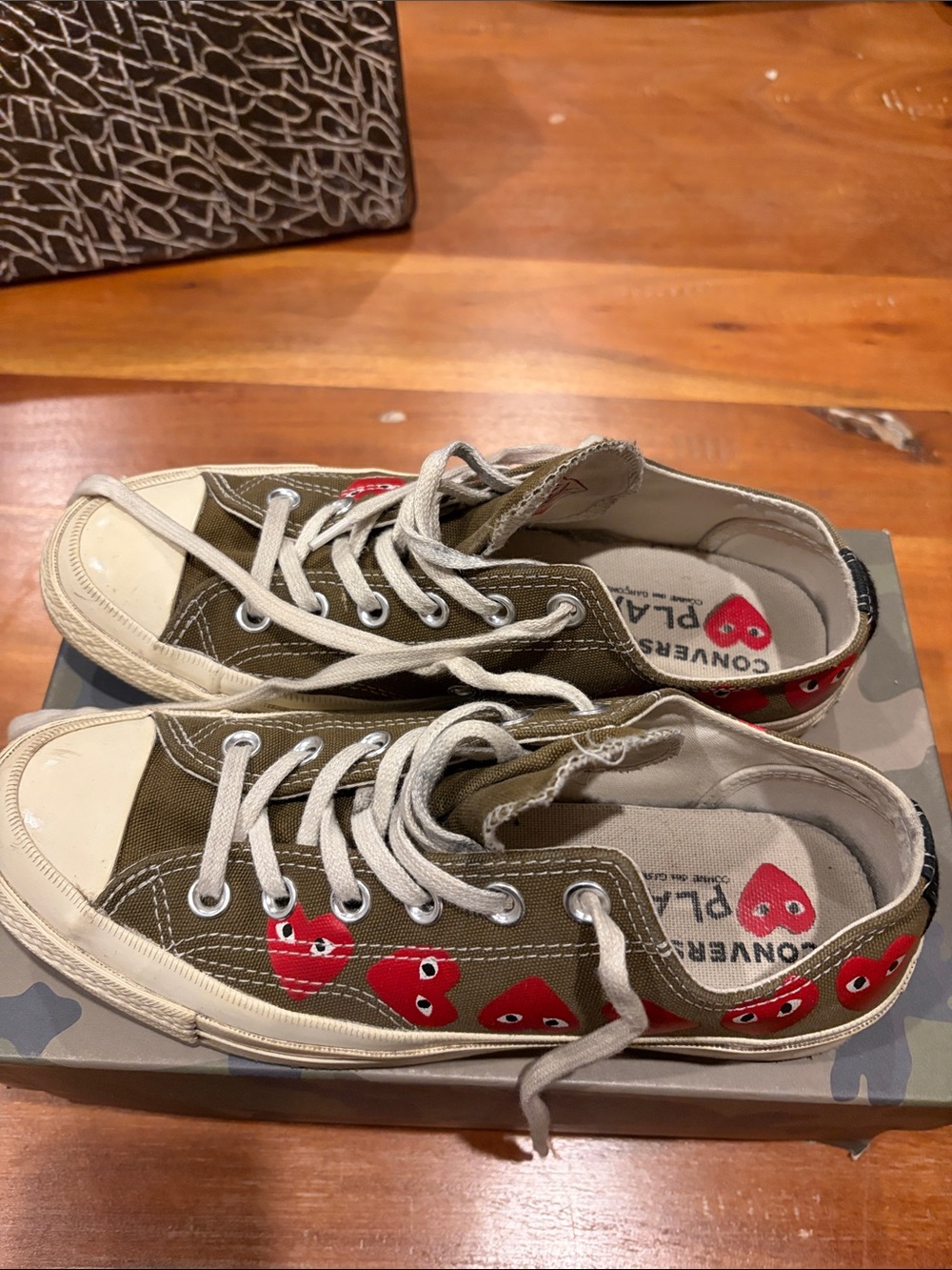 Comme des Garcons PLAY Olive Green Low-Top Sneakers with Red Heart Motif